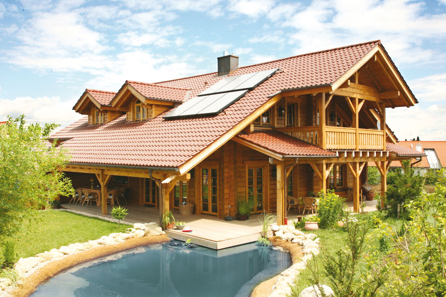 Holzhaus aus massiven Kantholzbalken „Kösslinger“